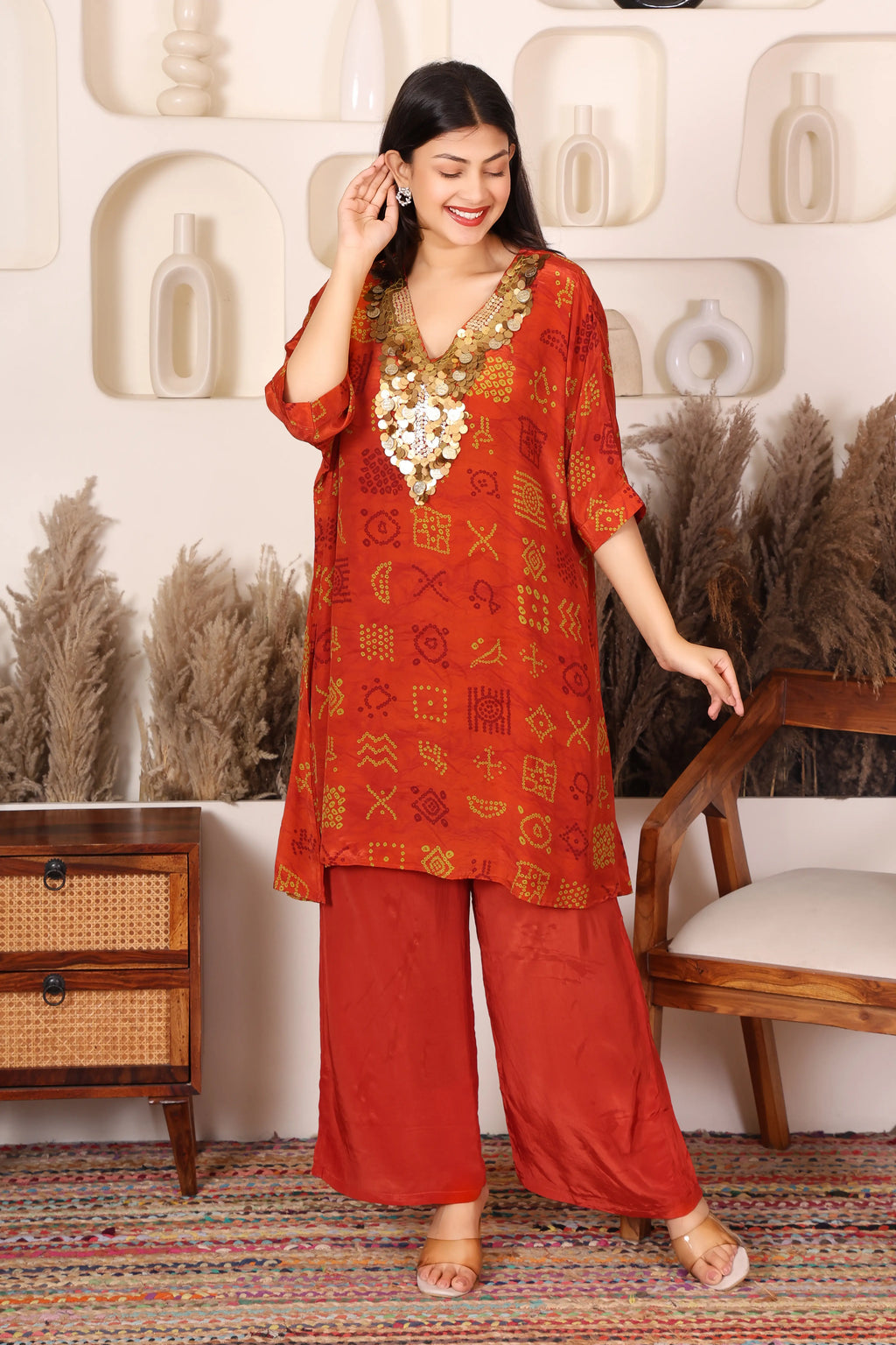 Woman in a red traditional outfit with gold Sequins patterns 