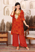 Woman in a red traditional outfit with gold Sequins patterns 