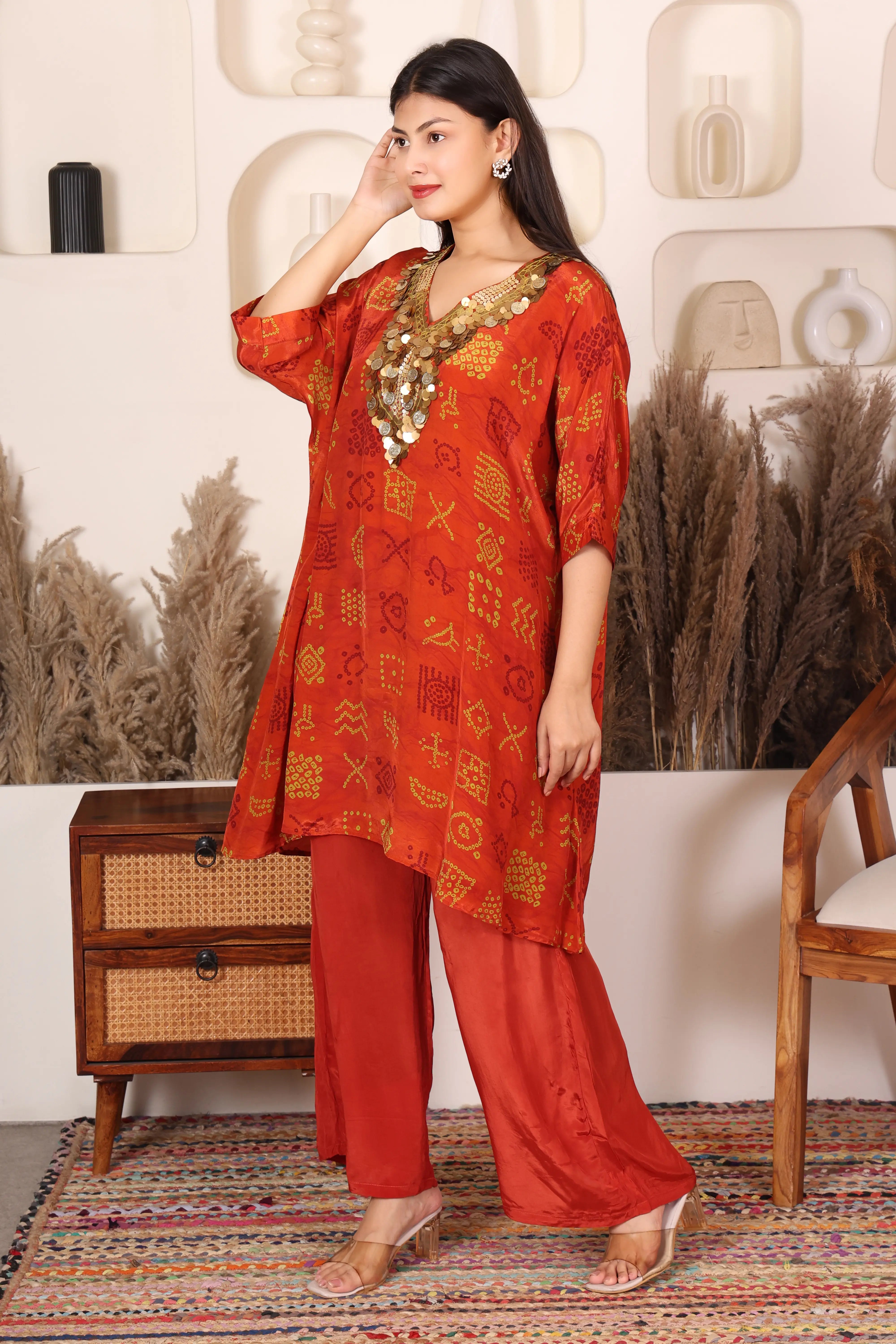 Woman in a red traditional outfit with gold Sequins patterns 