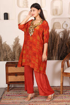 Woman in a red traditional outfit with gold Sequins patterns 