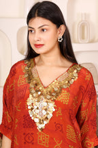 Woman in a red traditional outfit with gold Sequins patterns 