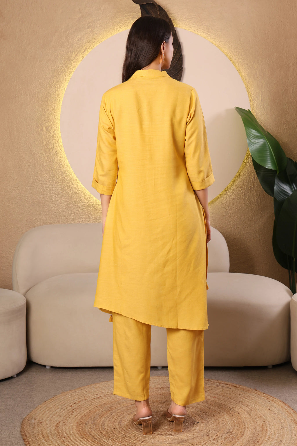 Woman wearing a yellow kurta with pants 
