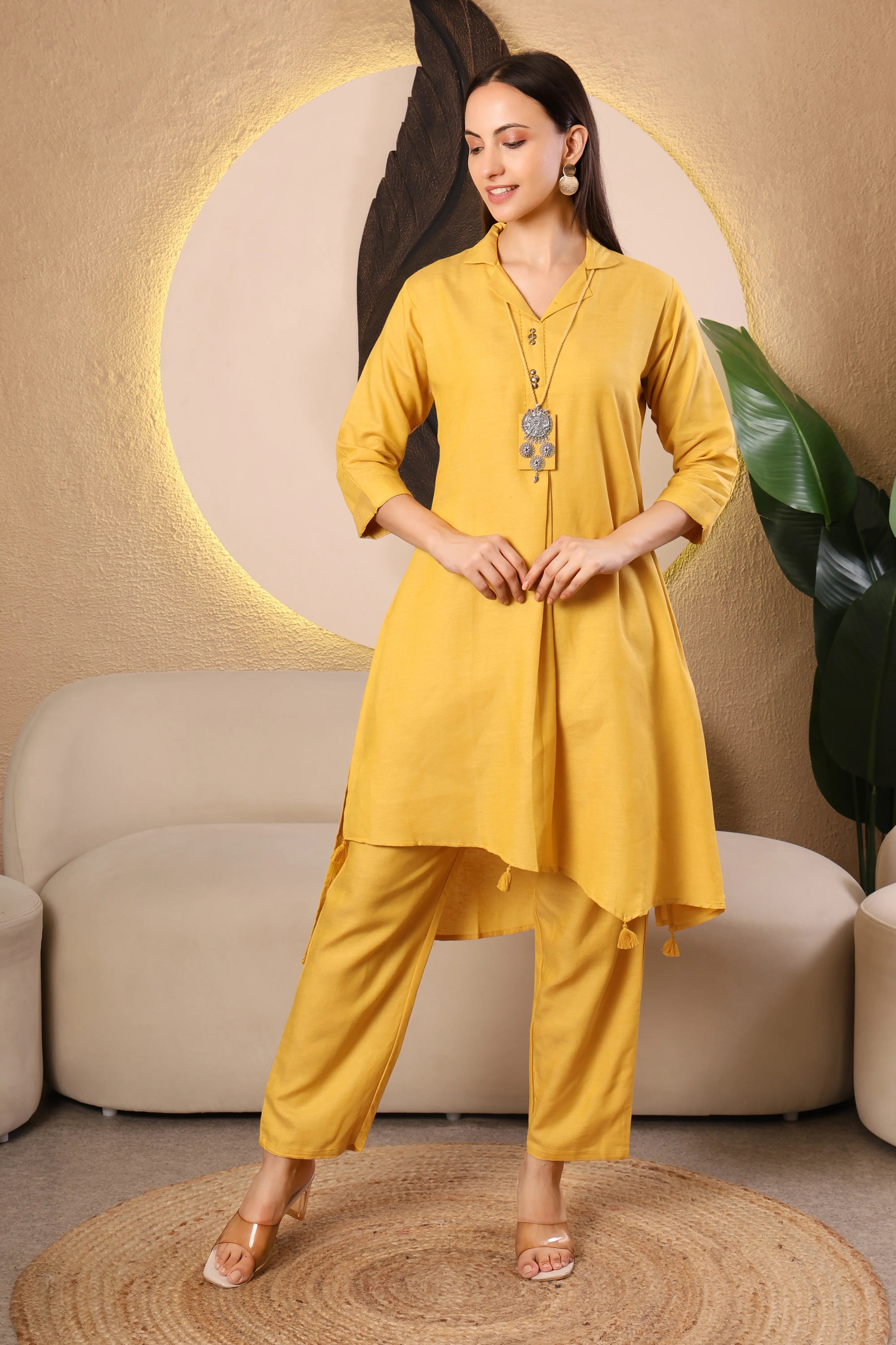 Woman wearing a yellow kurta with pants 