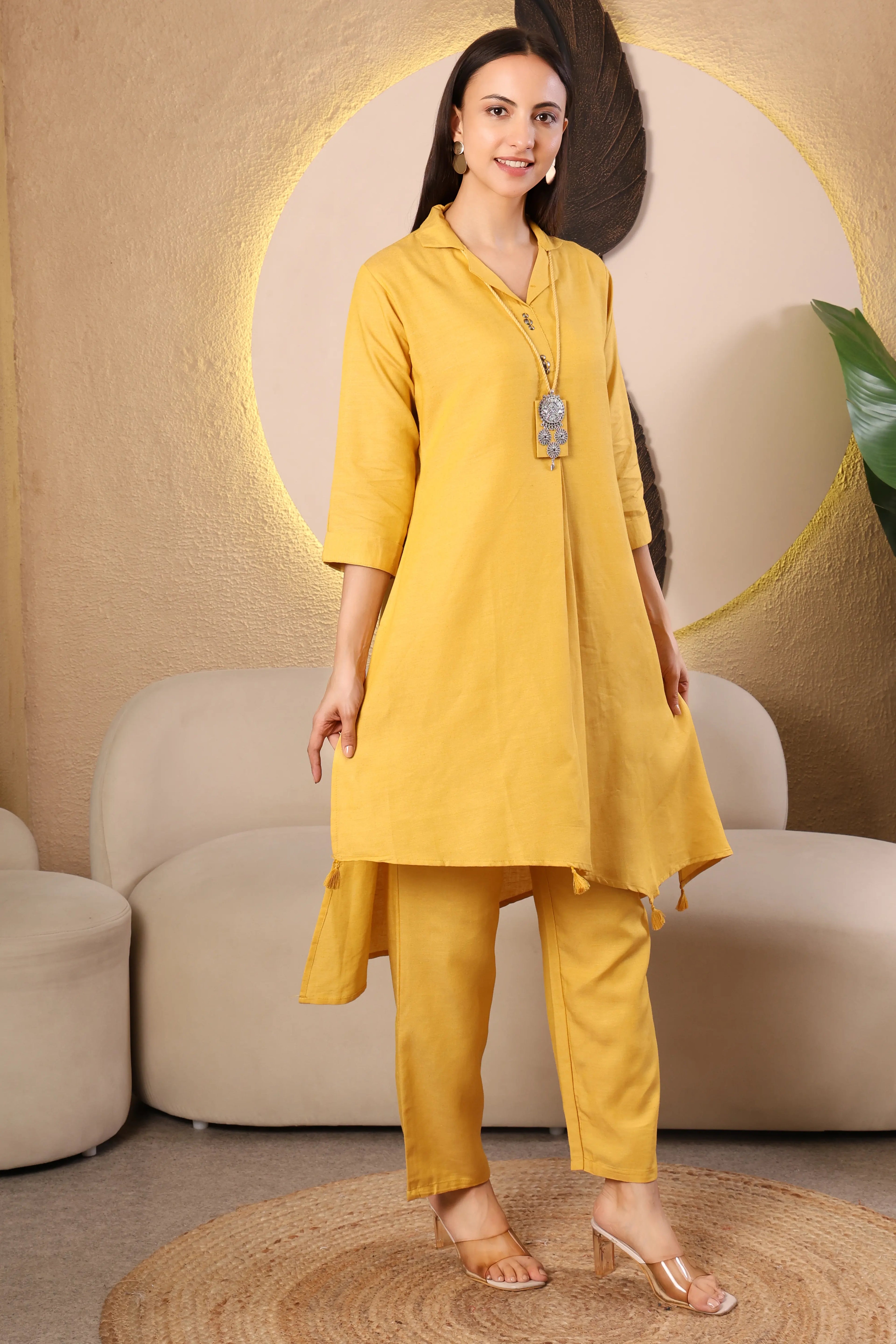 Woman wearing a yellow kurta with pants 