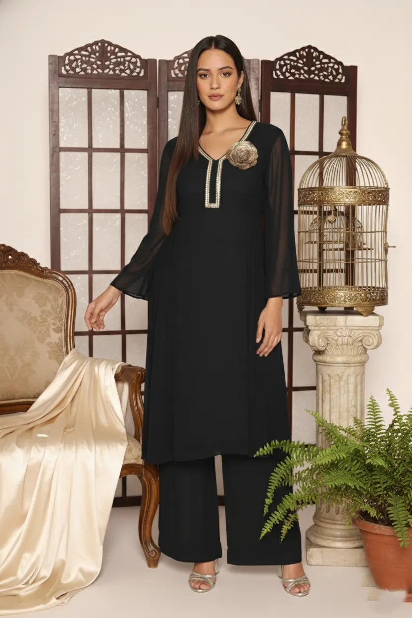 Woman wearing a  black pure georgette kurti set, detailed with shimmering cutdana and stone work. Paired with soft crepe bell-bottom pants and a shantoon lining,