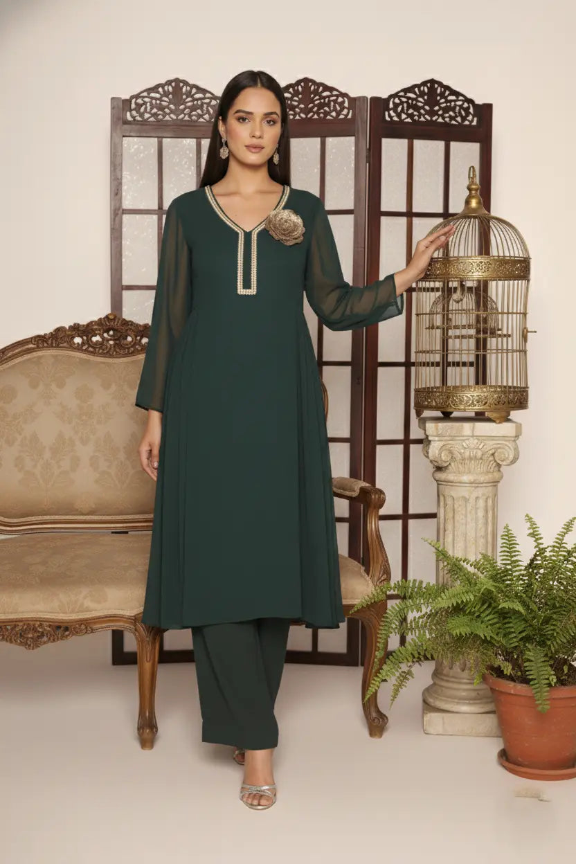 Elegant bottle green georgette kurti set with side pleats, sequin-detailed neckline, floral embellishment, shantoon lining, and crepe bell-bottom pants.